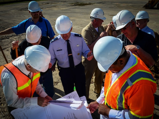 Col. Richard McComb, Joint Base Charleston commander (center), reviews the layout of the new Visitor Center with project officers after a ground-breaking ceremony April 10, 2013, at Joint Base Charleston – Weapons Station, S.C. (U.S. Air Force photo/Staff Sgt. Anthony Hyatt)