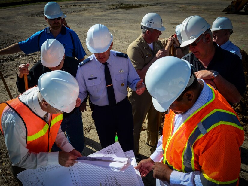 Col. Richard McComb, Joint Base Charleston commander (center), reviews the layout of the new Visitor Center with project officers after a ground-breaking ceremony April 10, 2013, at Joint Base Charleston – Weapons Station, S.C. (U.S. Air Force photo/Staff Sgt. Anthony Hyatt)