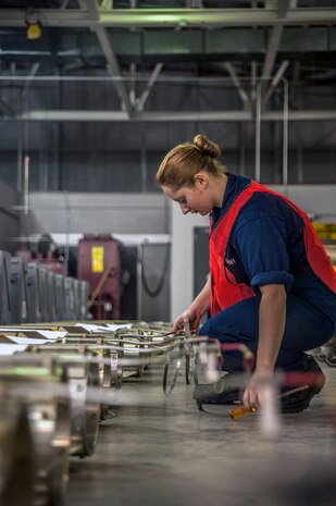 Seaman Karolina Denert, Navy Munitions Command Unit Charleston machinist’s mate, inspects MK16 tail sections during a bi-annual Mine Readiness Certification April 1, 2013, at Joint Base Charleston – Weapons Station, S.C. (U.S. Air Force photo / Airman 1st Class Tom Brading)