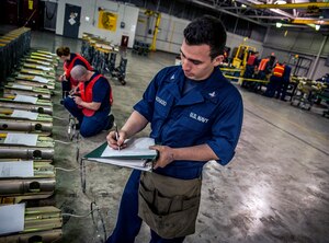 Petty Officer 3rd Class Daniel Machago, Navy Munitions Command Unit Charleston machinist’s mate, completes Master Record Sheet information for MK16 tail sections during a bi-annual Mine Readiness Certification April 1, 2013, at Joint Base Charleston – Weapons Station, S.C. (U.S. Air Force photo / Airman 1st Class Tom Brading)