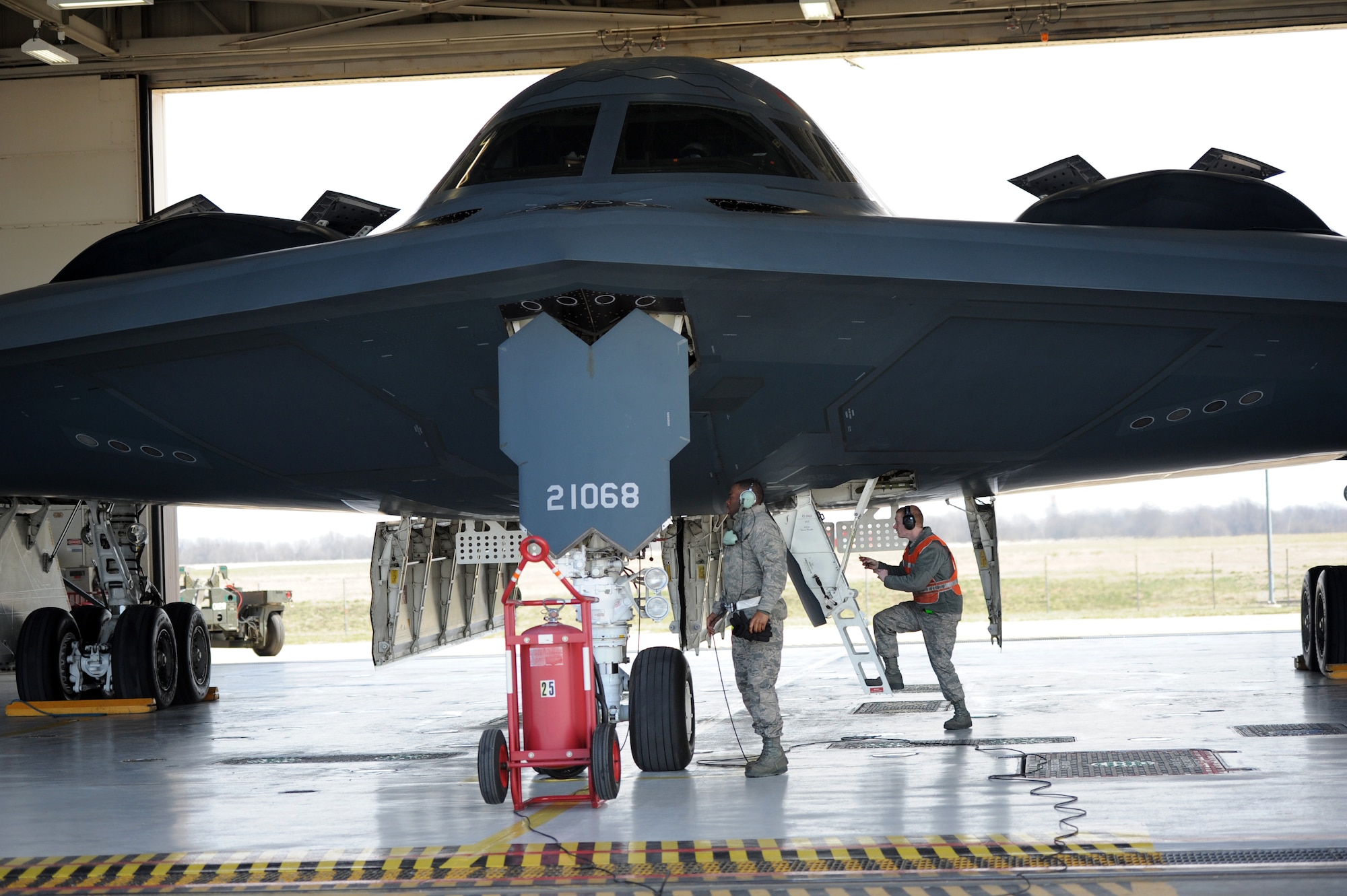 Airman 1st Class Steven McCray, 13th Aircraft Maintenance Unit B-2 Spirit crew chief, and Airman 1st Class James Fulton, 13th Aircraft Maintenance Unit B-2 crew chief, perform pre-flight checks on the “Spirit of New York” at Whiteman Air Force Base, April 5, 2013.  Because of their mission and constant operations tempo, B-2 crew chiefs must remain alert and aware of every maintenance issue on their assigned aircraft. (U.S. Air Force photo by Staff Sgt. Nick Wilson/Released)