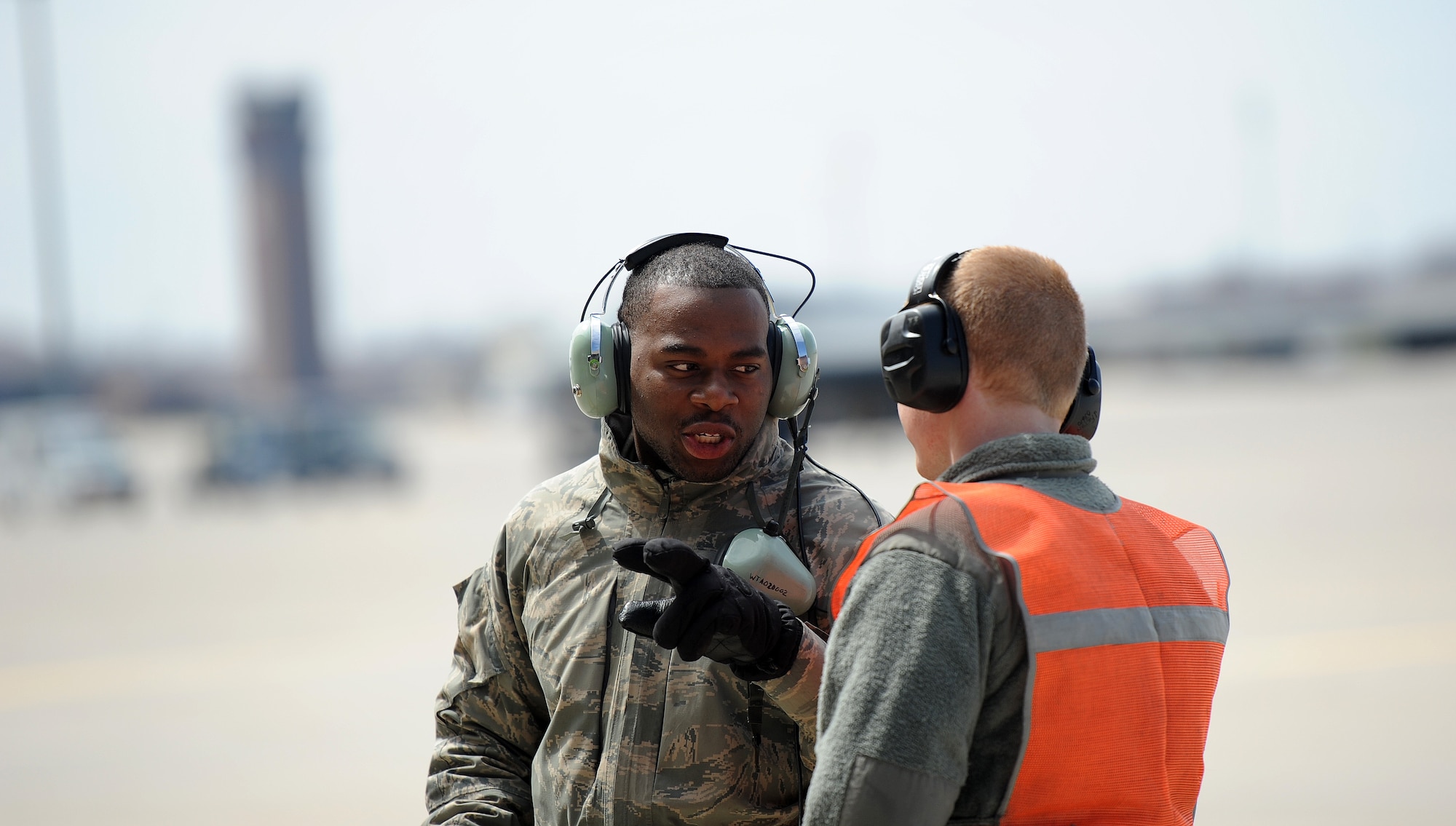 Airman 1st Class Steven McCray, 13th Aircraft Maintenance Unit B-2 Spirit crew chief, and Airman 1st Class James Fulton, 13th Aircraft Maintenance Unit B-2 crew chief, discuss pre-flight procedures at Whiteman Air Force Base, April 5, 2013.  Because of their mission and constant operations tempo, B-2 crew chiefs must remain alert and aware of every maintenance issue involving their assigned aircraft. (U.S. Air Force photo by Staff Sgt. Nick Wilson/Released)