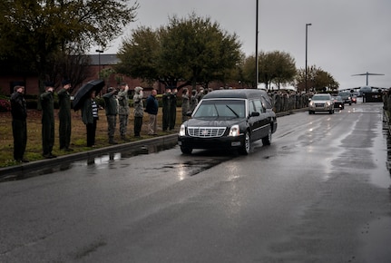 Airmen salute as the body of United States Army Chief Warrant Officer 5th Class Curtis Reagan, 43, of Summerville, S.C., passes by April 4, 2013, at Joint Base Charleston – Air Base, S.C. Reagan, 43, of Summerville, S.C., died March 29, 2013, in Kandahar, Afghanistan, from a non-combat related illness. Reagan’s remains were flown from Dover, Del., to Charleston. (U.S. Air Force photo/ Senior Airman Dennis Sloan)