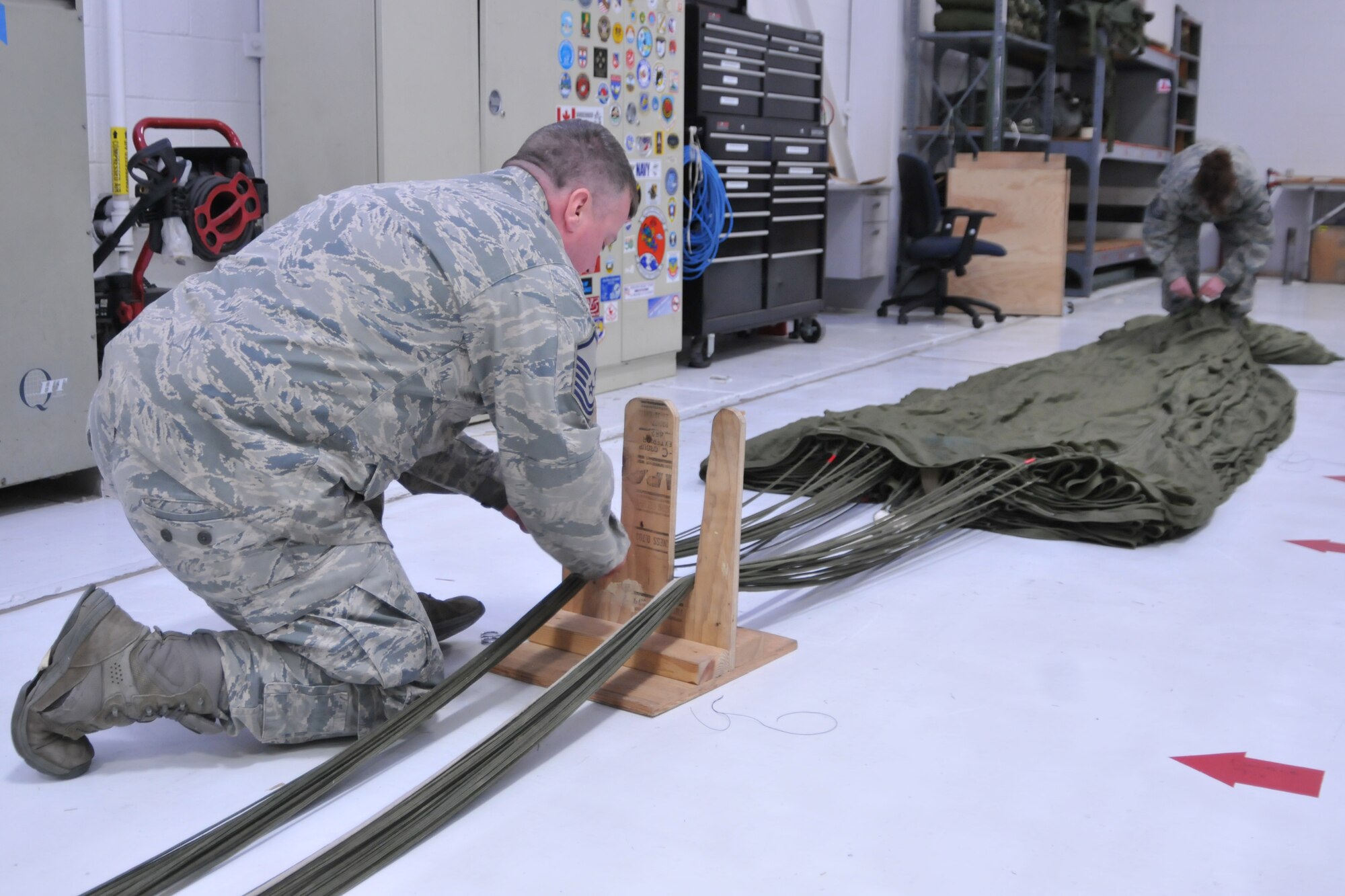 YOUNGSTOWN AIR RESERVE STATION, Ohio—Master Sgt. Brad Franken prepares a G12 parachute for packing Saturday, April 6, 2013 here. Franken is an aerial delivery maintainer for the 76th Aerial Port Squadron, here. (U.S. Air Force photo/Technical Sergeant Jim Brock)