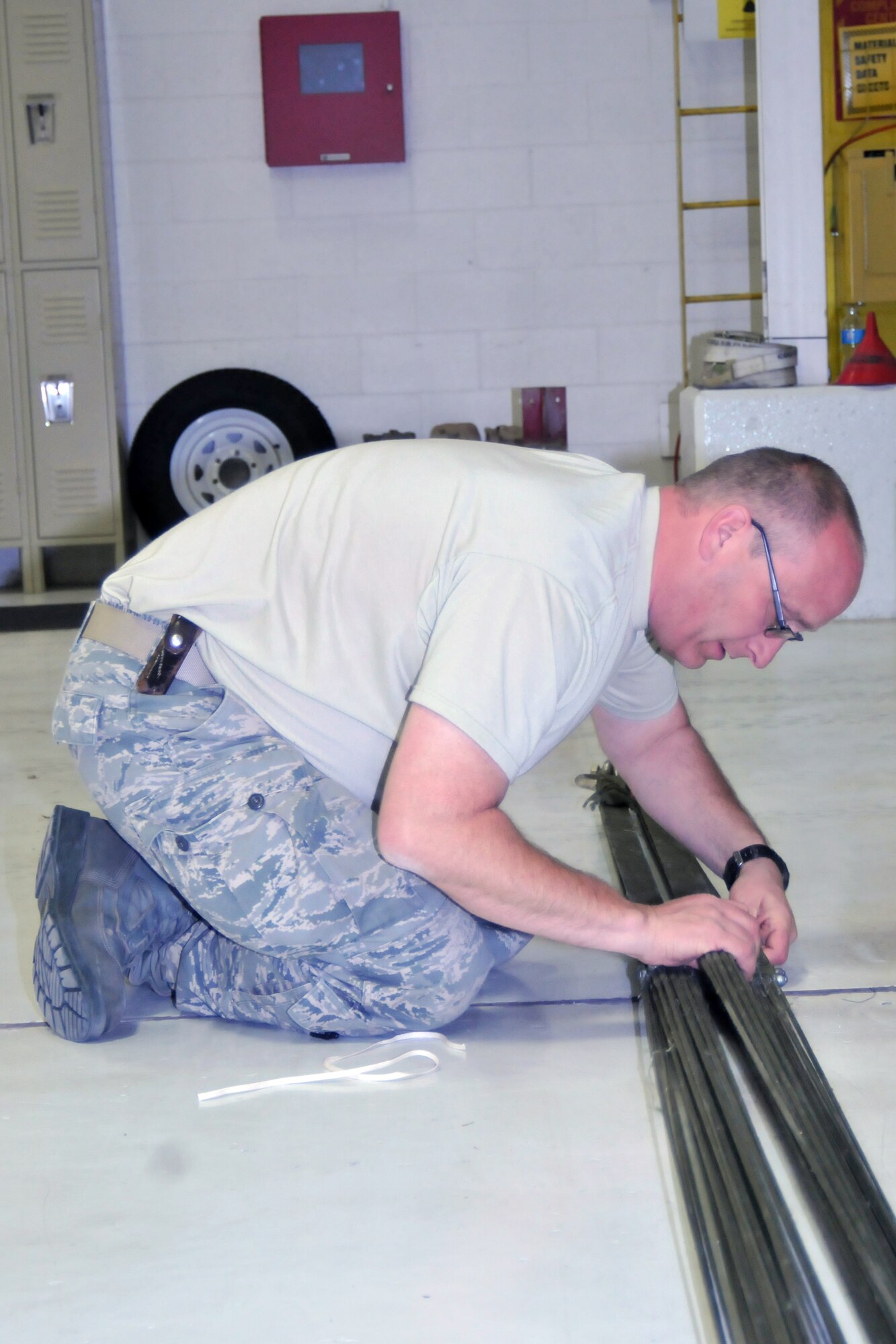 YOUNGSTOWN AIR RESERVE STATION, Ohio—Technical Sgt. Lemkner prepares a G12 parachute for packing Saturday, April 6, 2013 here. Lemkner  is an aerial delivery maintainer for the 76th Aerial Port Squadron here. (U.S. Air Force photo/Technical Sergeant Jim Brock)
