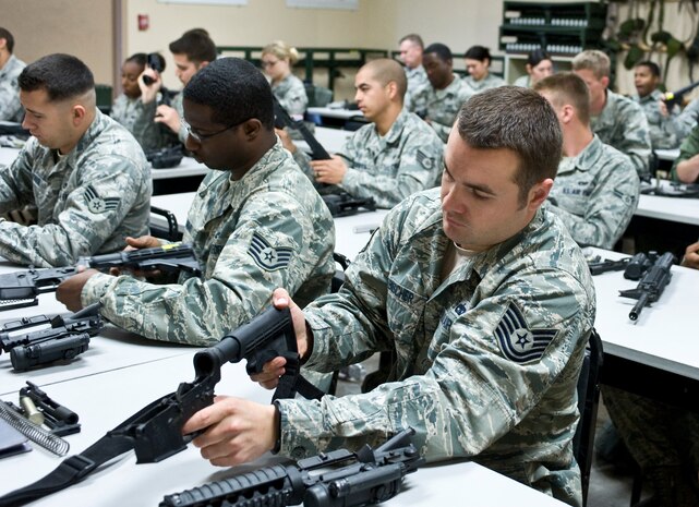 Nellis and Creech Air Force Base Airmen attend a combat arms training and maintenance class April 9, 2013, at Nellis Air Force Base, Nev. CATM classes are held Monday through Friday for either the M4 carbine assault rifle or the M9 pistol. (U.S. Air Force photo by Senior Airman Matthew Lancaster)