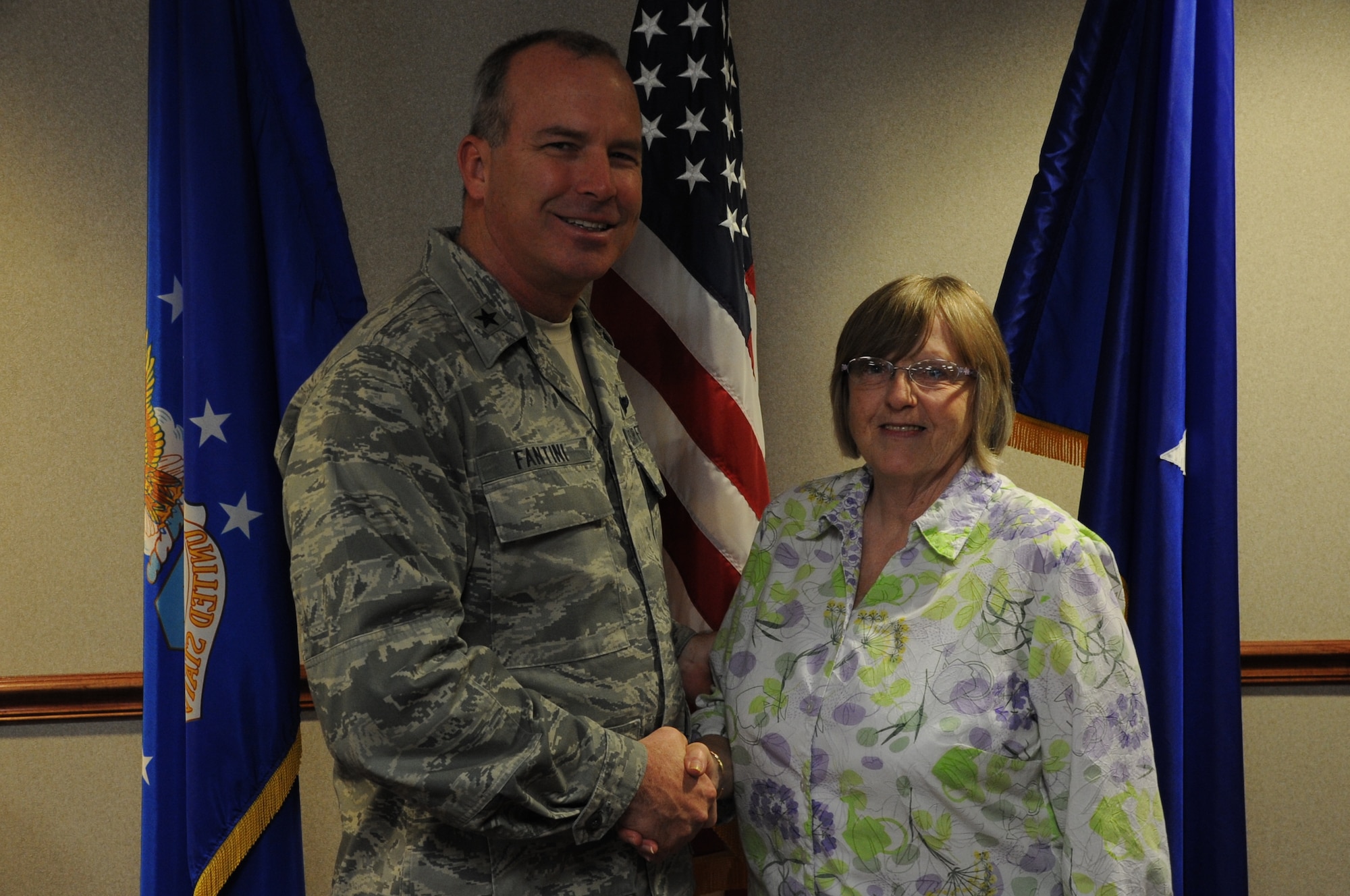 Janice Arguello, an assistant for the legal office, accepts the Wingman of Choice award from Brig. Gen. Michael Fantini, 82nd Training Wing commander. Arguello was nominated due to her professionalism and work ethic. (U.S. Air Force photo by Airman 1st Class Jelani Gibson) 
