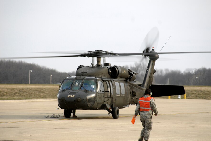 A UH-60 Black Hawk helicopter carrying U.S. Marine Sgt. Maj. Bryan Battaglia, the senior non-commissioned officer of the U.S. Armed Forces, arrives at the 182nd Airlift Wing in Peoria, Ill., April 6, 2013.  Battaglia currently serves as the Senior Enlisted Advisor to the Chairman of the Joint Chiefs of Staff.  He visited the installation to discuss the state of the enlisted corps with Illinois soldiers and airmen in a town hall-style meeting.  (U.S. Air Force photo by Staff Sgt. Lealan Buehrer//Released)