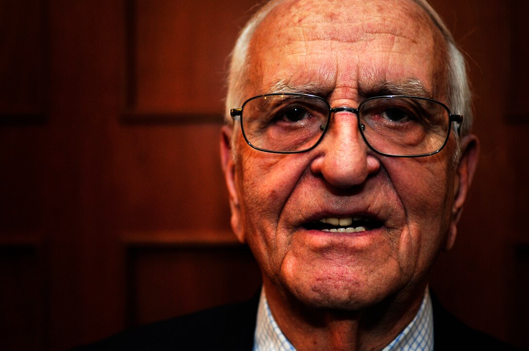 Henry Greenbaum, a holocaust survivor, spoke to members of Joint Base Andrews, Md., in honor of Holocaust Remembrance Day, April 9, 2013. Greenbaum spoke about his losses, struggle, and eventually, his liberation by American forces. Following his story, Greenbaum allowed for a question and answer session, which he discussed his resiliency and faith, which helped him through the Holocaust. (U.S. Air Force photo/Senior Airman Lauren Main)
