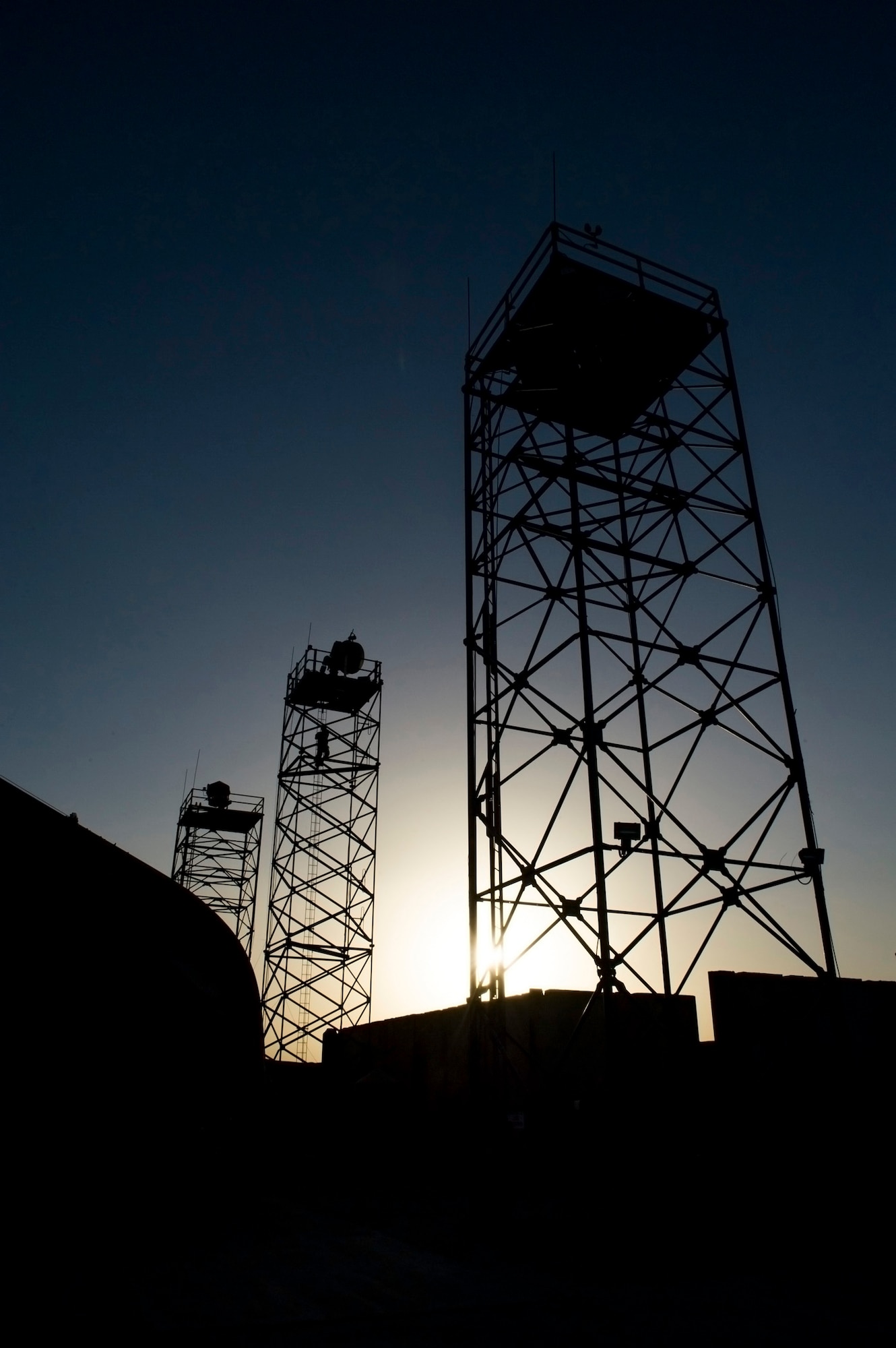 Airman 1st Class Alexander, 62nd Expeditionary Reconnaissance Squadron ground control station communications technician, climbs to the top of a ground data terminal tower, March 13, 2013, on Kandahar Airfield, Afghanistan. As a GCS communication technician, Alexander manages the communications in the cockpit that is used to fly remotely piloted aircraft. (U.S. Air Force photo by Staff Sgt. Marleah Miller)