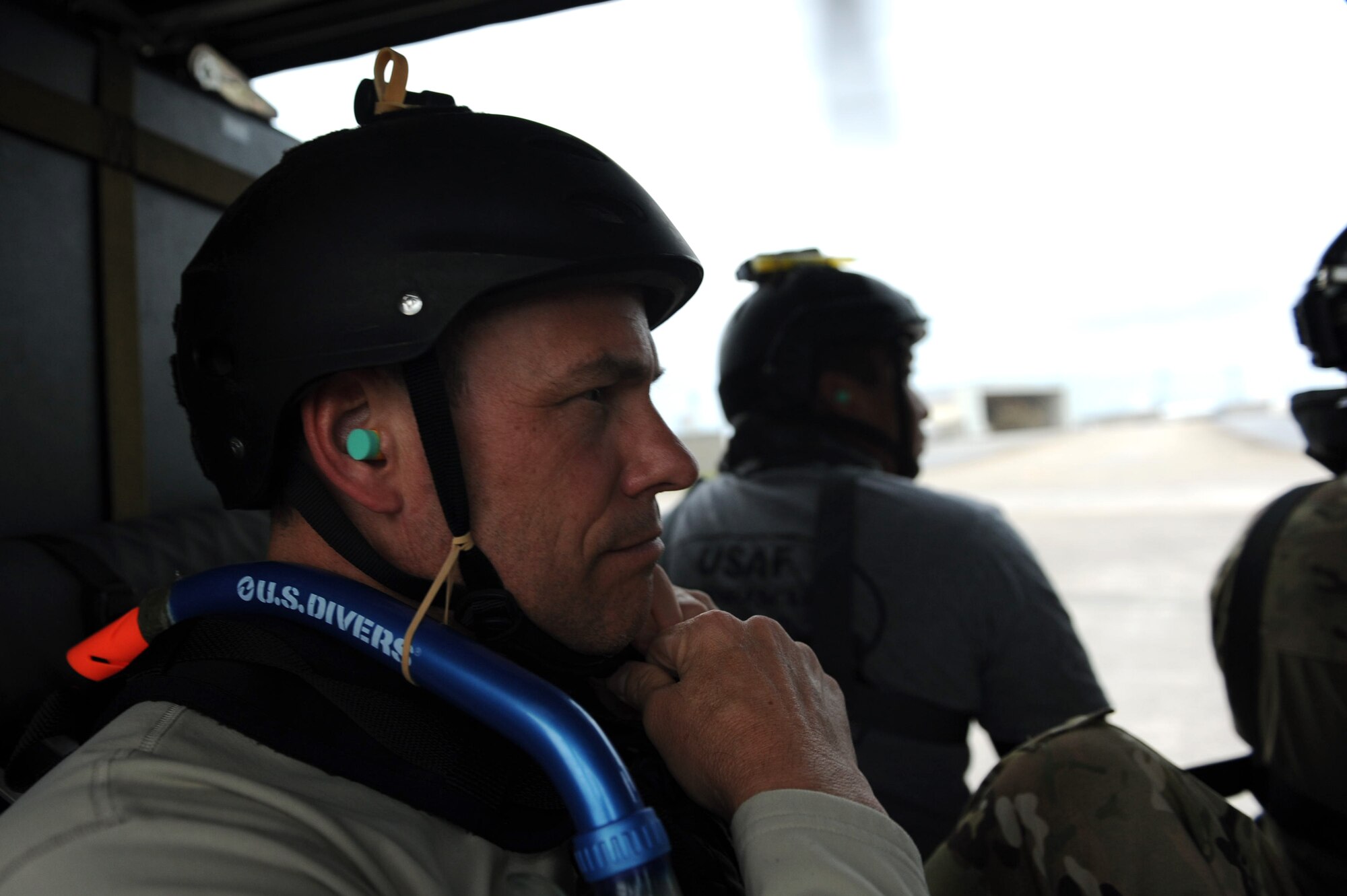 U.S. Air Force Brig. Gen. Matt Molloy, 18th Wing commander, clasps the chinstrap of his helmet together while preparing for a day-water rescue scenario on Kadena Air Base, Japan, April 9, 2013. Molloy is slated to hand over command of the wing to his successor in a change of command ceremony in May. (U.S. Air Force photo by Airman 1st Class Hailey R. Davis)