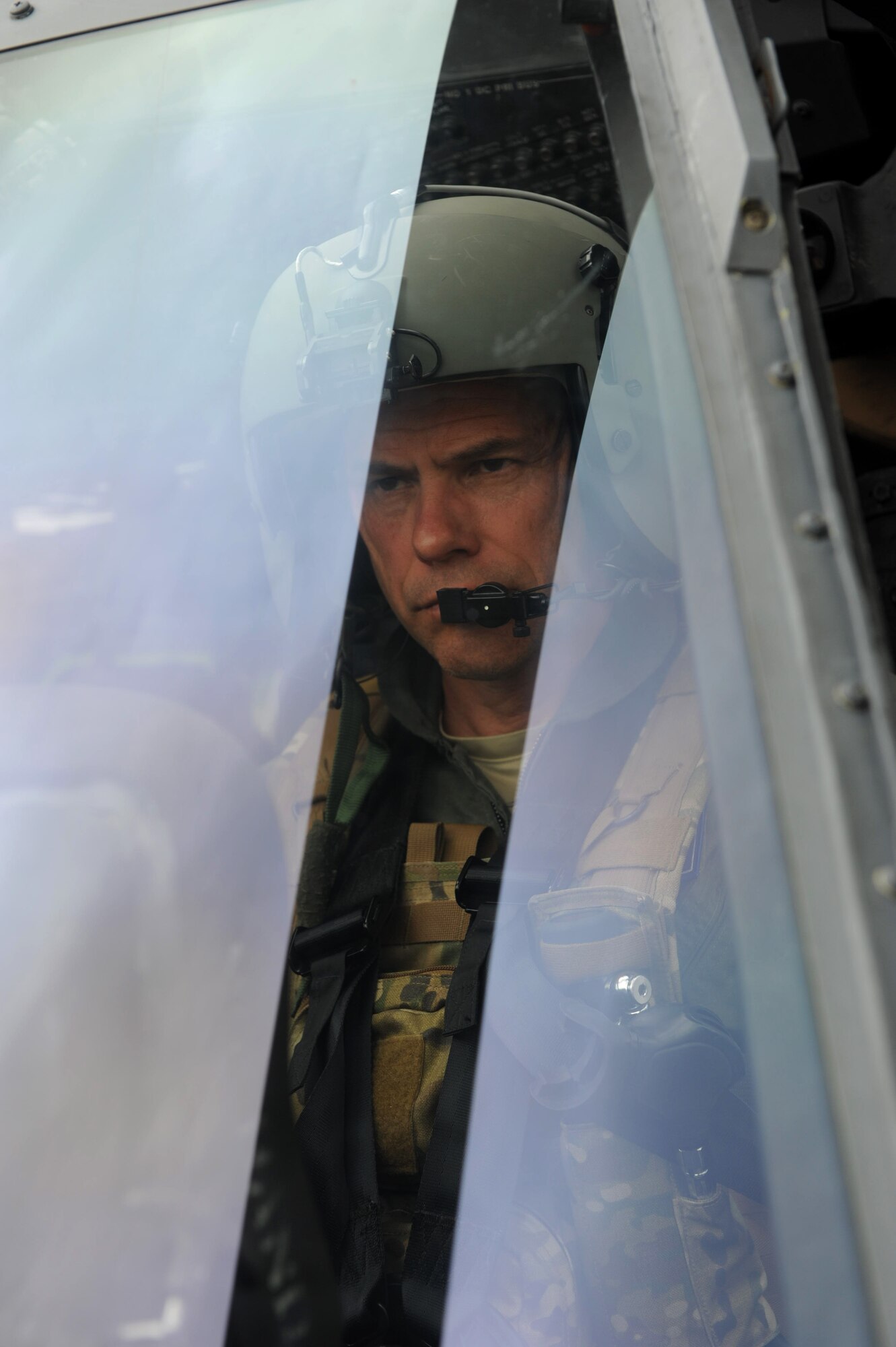U.S. Air Force Brig. Gen. Matt Molloy, 18th Wing commander, prepares for an HH-60G Pave Hawk helicopter flight at Kadena Air Base, Japan, April 9, 2013. During the flight, Molloy participated in a range training exercise, followed by a day-water rescue scenario. (U.S. Air Force photo by Airman 1st Class Hailey R. Davis)