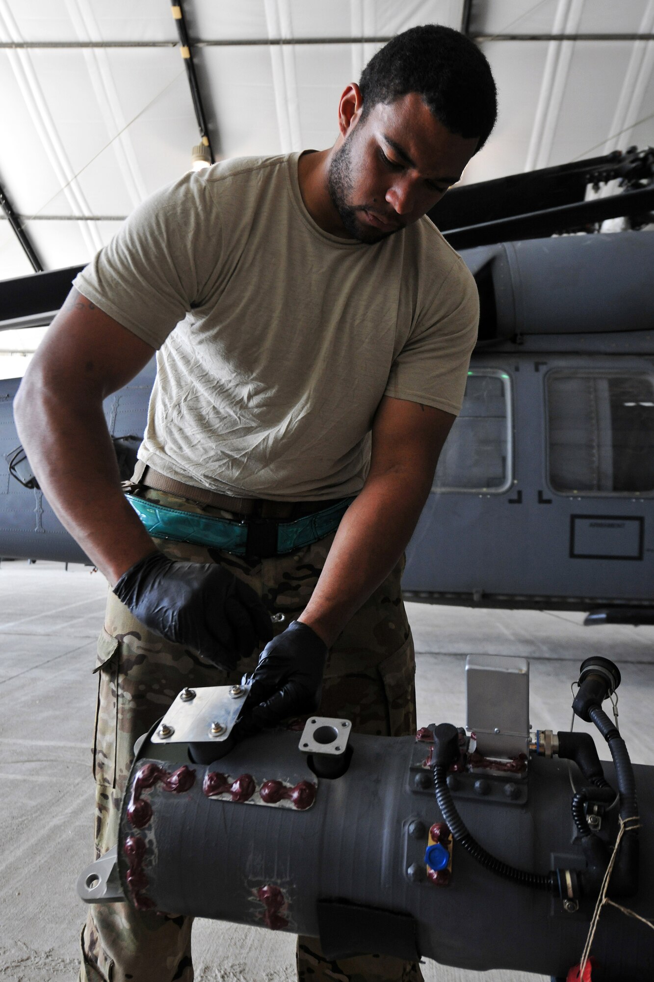 Staff Sgt. Bernard Williams, 455th Expeditionary Aircraft Maintenance Squadron 83rd Helicopter Maintenance Unit crew chief, prepares the changing of a fuel assist on a HH-60 Pave Hawk helicopter on Bagram Airfield, Afghanistan, April 9, 2013. William serves on a team of helicopter maintainers who enable Bagram’s Combat Search and Rescue capability in support of NATO and Afghan security forces. (U.S. Air Force photo/Senior Airman Chris Willis)