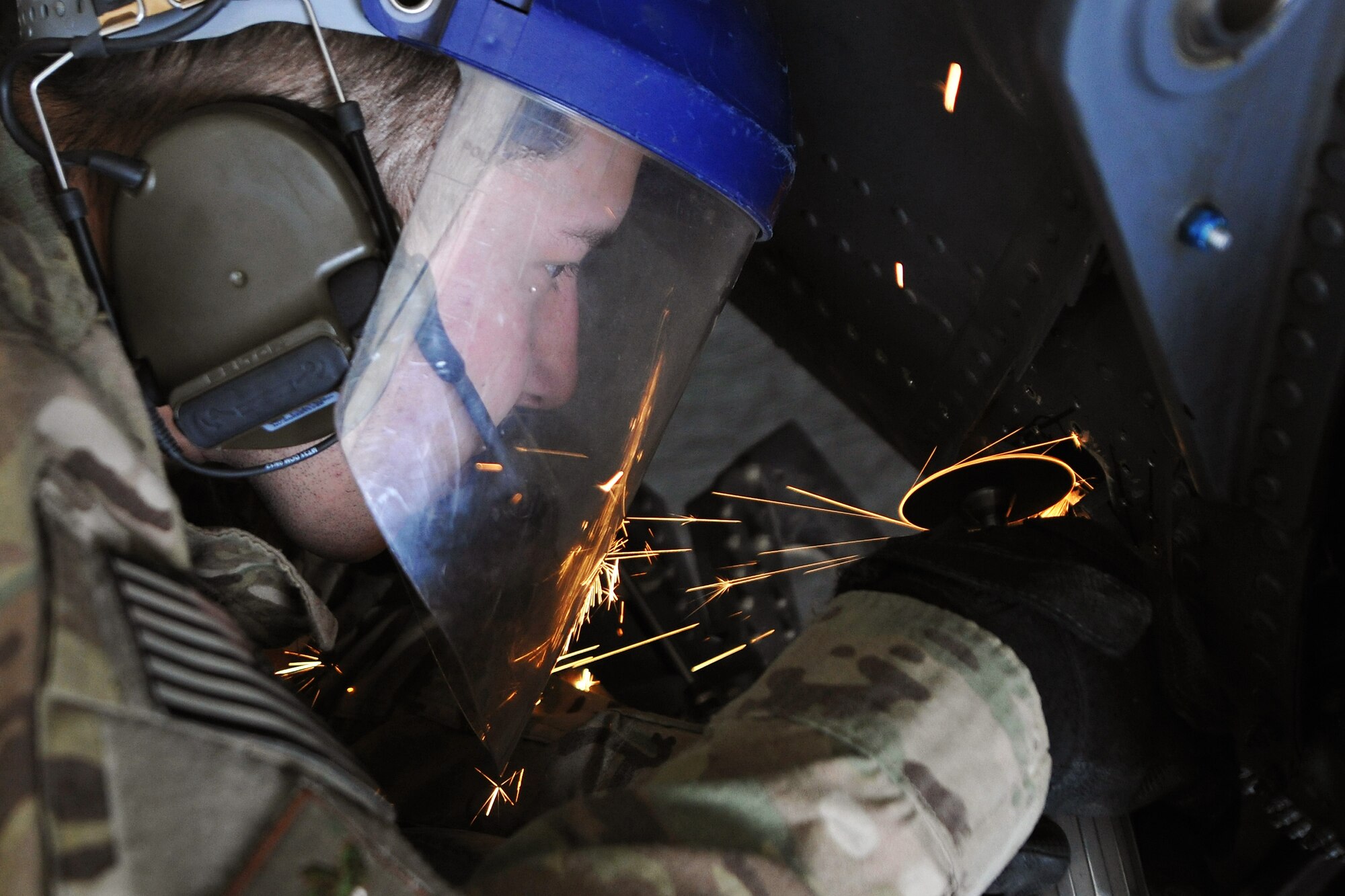 Airman 1st Class Zachary Hughes, 455th Expeditionary Aircraft Maintenance Squadron 83rd Helicopter Maintenance Unit aircraft structural maintainer, repairs a damaged panel on HH-60 Pave Hawk helicopter on Bagram Airfield, Afghanistan, April 9, 2013. Hughes serves on a team of helicopter maintainers who enable Bagram’s Combat Search and Rescue capability in support of NATO and Afghan security forces. (U.S. Air Force photo/Senior Airman Chris Willis)