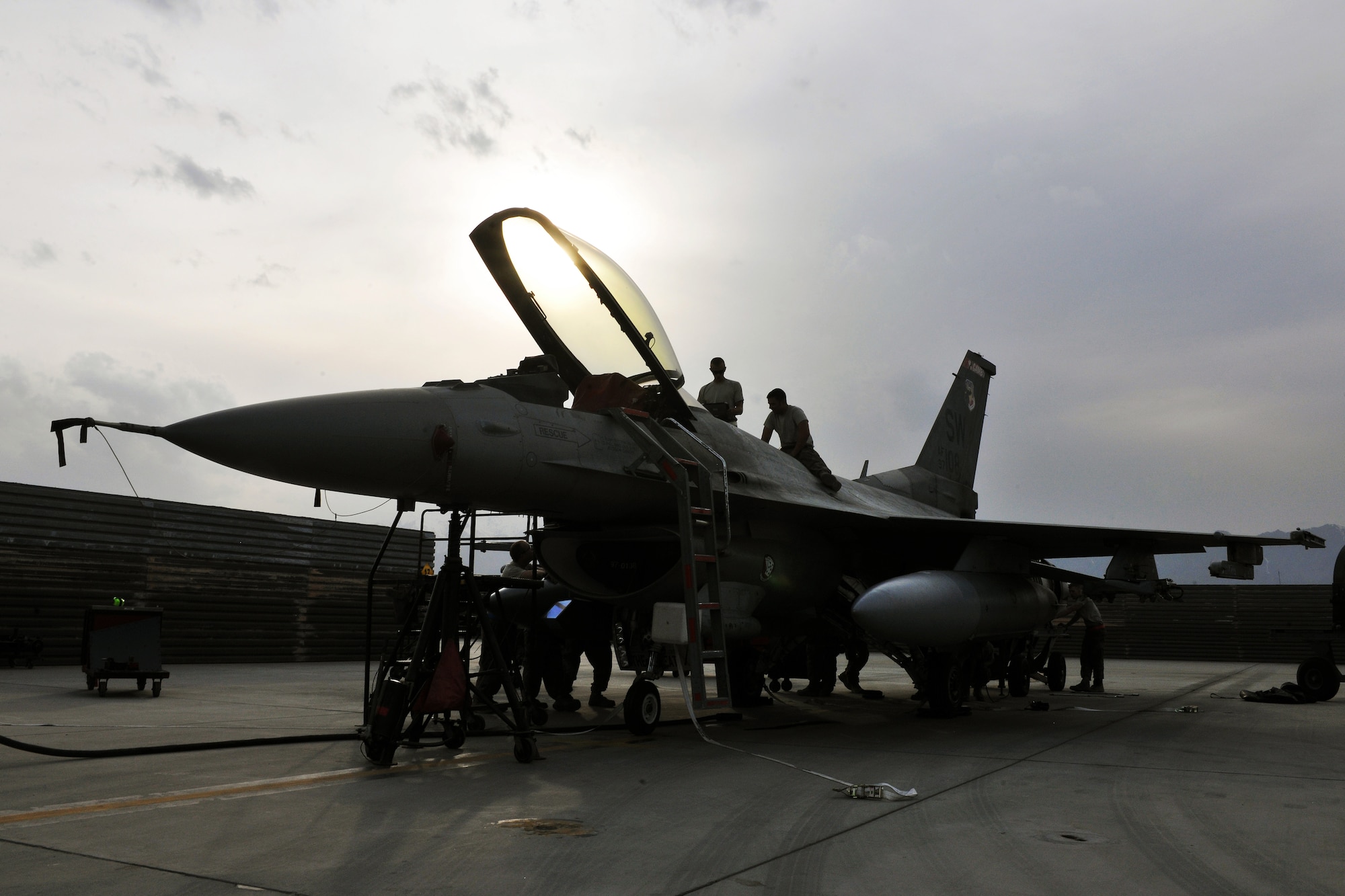 Dedicated crew chiefs deployed from Shaw Air Force Base, S.C., replace a panel on an F-16 Fighting Falcon during a post flight inspection at Bagram Airfield, Afghanistan, Apr. 6, 2013. The aircraft receive inspections before takeoff and after landing to ensure the safety of the aircraft and pilot. (U.S. Air Force photo/Senior Airman Chris Willis) 