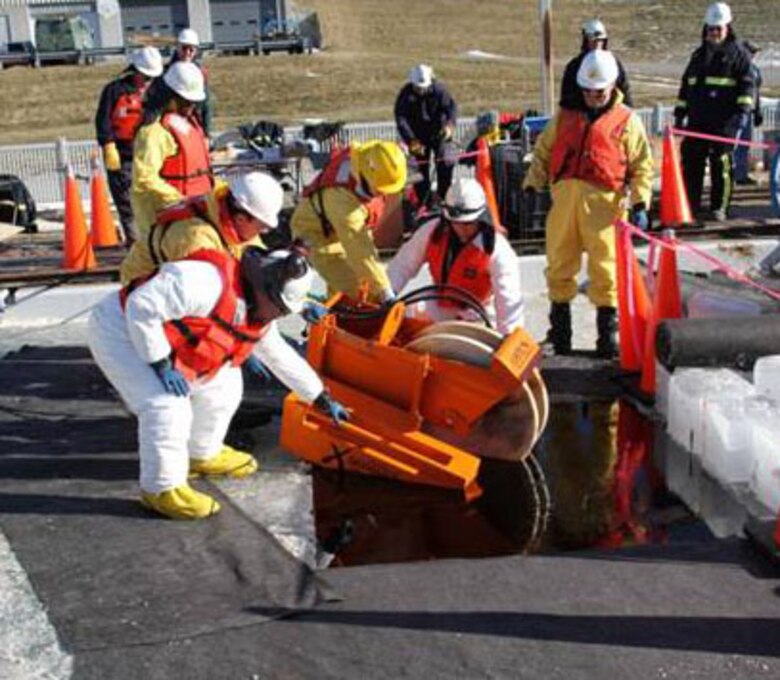 Arctic oil spill responders place a mechanical skimmer used for oil recovery during their recent training with Alaska Clean Seas instructors, hosted at ERDC-CRREL. 