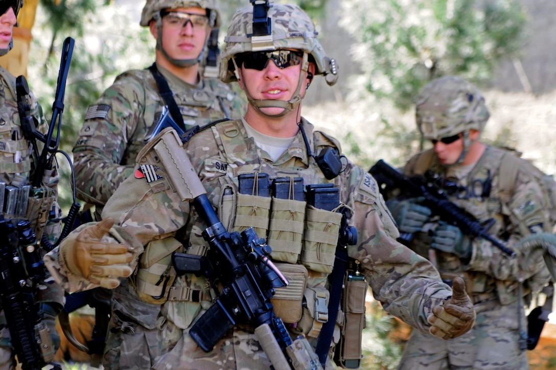 U.S. soldiers prepare to move out on a patrol in the Khogyani district ...