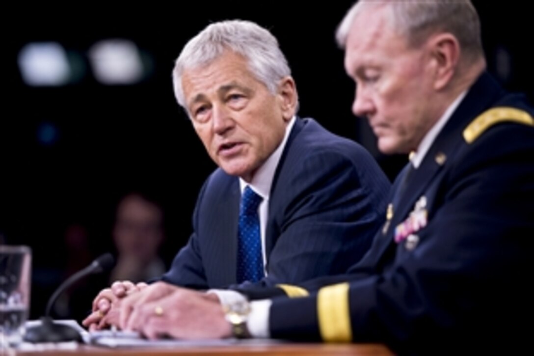 Defense Secretary Chuck Hagel and Army Gen. Martin E. Dempsey, chairman of the Joint Chiefs of Staff, brief the press at the Pentagon, April 10, 2013. Hagel and Dempsey discussed President Barack Obama's budget directive for the 2014 fiscal year and the continuing effects of sequestration on the defense budget.