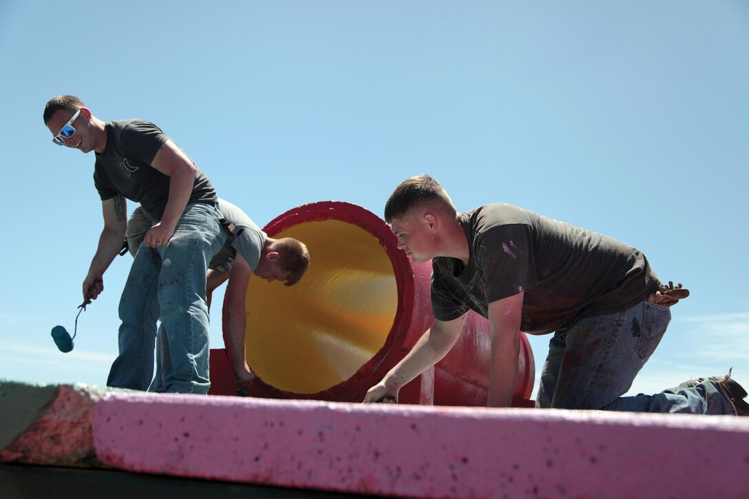 Marines apply a fresh coat of paint to playground equipment at Liguan Terrace, Dededo, Guam, March 28 in an effort to restore Guam’s green space during Exercise Guahan Shield. The Marines worked with Guam’s Islandwide Beautification Task Force and Noncommunicable Disease Consortium’s Physical Activities Team. The Marines are participating in Guahan Shield, which facilitates multiservice engagements, sets conditions for bilateral and multilateral training opportunities, and supports rapid response to potential crises and contingency operations in the Asia-Pacific region. Photo by Lance Cpl. Pete Sanders