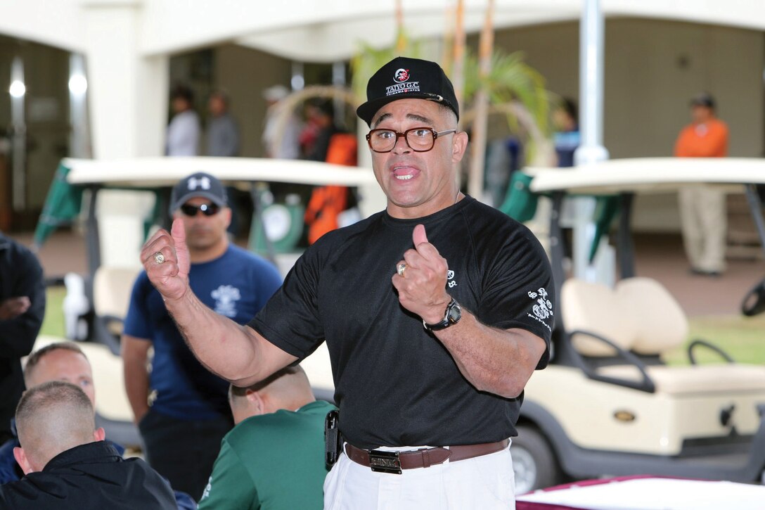 Sgt. Maj. Robert L. Caldwell addresses guests during his farewell at Taiyo Golf Course March 21. Caldwell’s catch phrase, “Shing-ding-a-ling,” was part of his gregarious personality, and Caldwell used it to describe his motivation about being a Marine and serving with other Marines. Courtesy photo