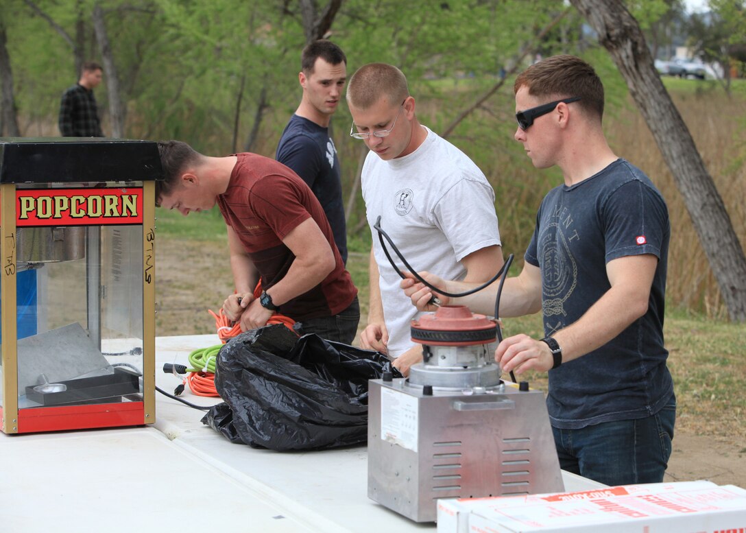 Marines with Alpha Company, 1st Radio Battalion, I Marine Expeditionary Force, set up for a family day at Camp Pendleton, Calif., April 5. The Marines and their families enjoyed a day at Lake O’Neill with food, games and entertainment.
