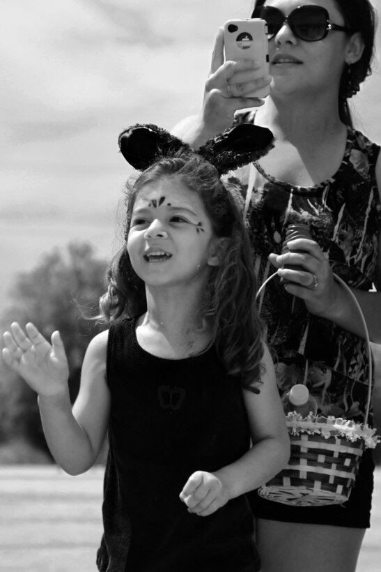 Yasmeen Tejeda, 5, cheers on her dad, Gunnery Sgt. Jose Tejeda, administration chief, Headquarters and Service Company, Combat Logisitcs Battalion 7, during the unit's field meet and family day events at Del Valle Field March 28, 2013.
