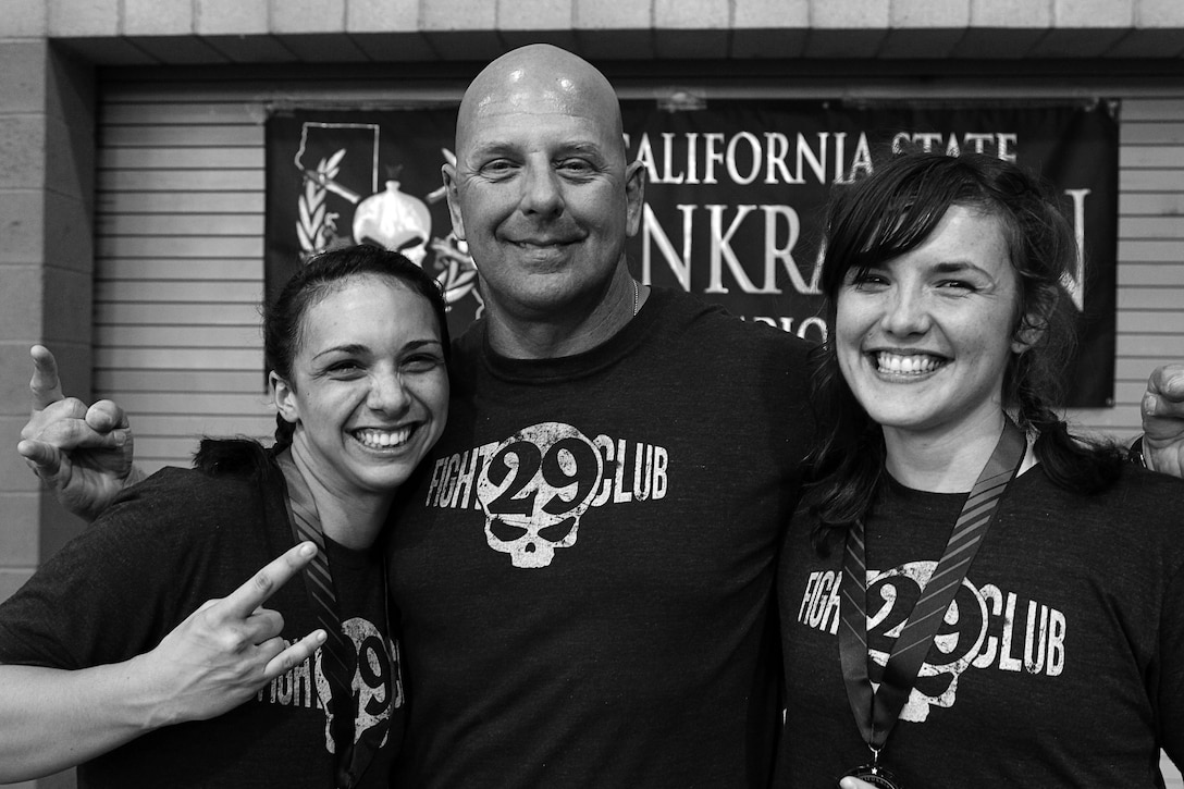 Kylie Guest and Katherine Proudfoot celebrate their first win in Fight Club 29 with Coach Mark Geletko, March 30, 2013.