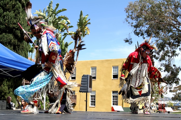 Richard Parker (left) and Richard Orvedal (right), both of the Omaha tribe, a Native American tribe out of Nebraska, dance traditional northern dances during Cultural Heritage Day aboard Marine Corps Recruit Depot San Diego April 4. Parker and Orvedal were wearing traditional Native American oufits made from American bald eagle feathers and porcupine quills.  