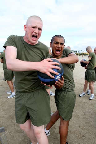 Recruits of Company G, 2nd Recruit Training Battalion, perform medicine ball twists during the Circuit Course aboard Marine Corps Recruit Depot San Diego, April 2.  The Circuit Course is made up of various stations focused on strength and endurance.