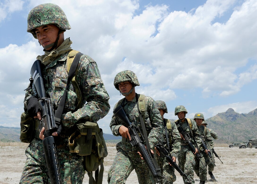 Philippine Marines march to a firing range April 7 at Crow Valley, Philippines, to participate in an bilateral expertise exchange live-fire drill with their U.S. Marine counterparts as part of Balikatan 2013, an annual bilateral training exercise currently in its 29th iteration. BK13 is designed to enhance interoperability between both forces and strengthen military-to-military relations. 