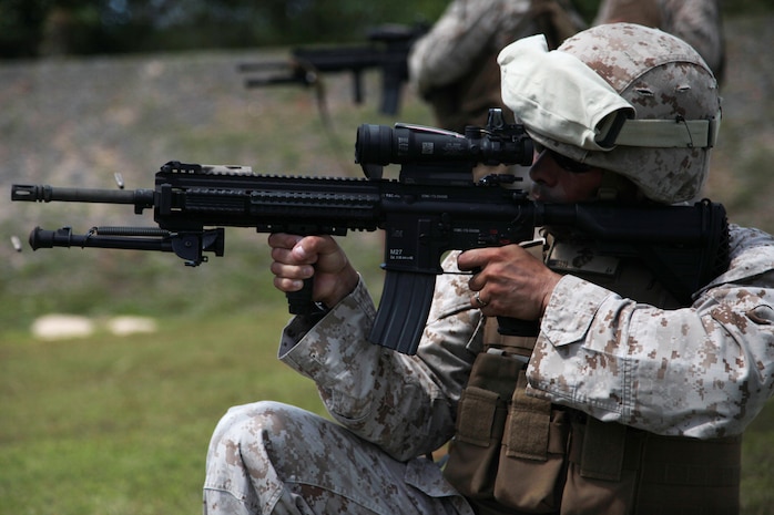 Gunnery Sgt. Patricio A. Mora fires the M-27 “Infantry Automatic Rifle” March 4 on an NCTS range during Exercise Guahan Shield.  The IAR design is based off of the M16 and M4 rifles service members have become familiar with.  Guahan Shield will facilitate multiservice engagements, set conditions for bilateral and multilateral training opportunities, and support rapid response to potential theatre crises and contingency operations in the Asia-Pacific region.  Mora is a Supply Chief with 3rd Marine Logistics Group, III Marine Expeditionary Force assigned to the Forward Command Element, 3rd MLG, III MEF as Logistics Chief for Guahan Shield. 