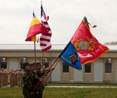 The color guard marches during a parade held at Mihal Kogalniceanu, Romania.  Marines and sailors with Black Sea Rotational Force 13 hold an opening ceremony to welcome BSRF-13 to M.K., Romania, April 10, 2013.  BSRF-13 will be based  out of M.K. and from there they will travel to 21 diffrent countries to promote regional security and engage our partner military forces.