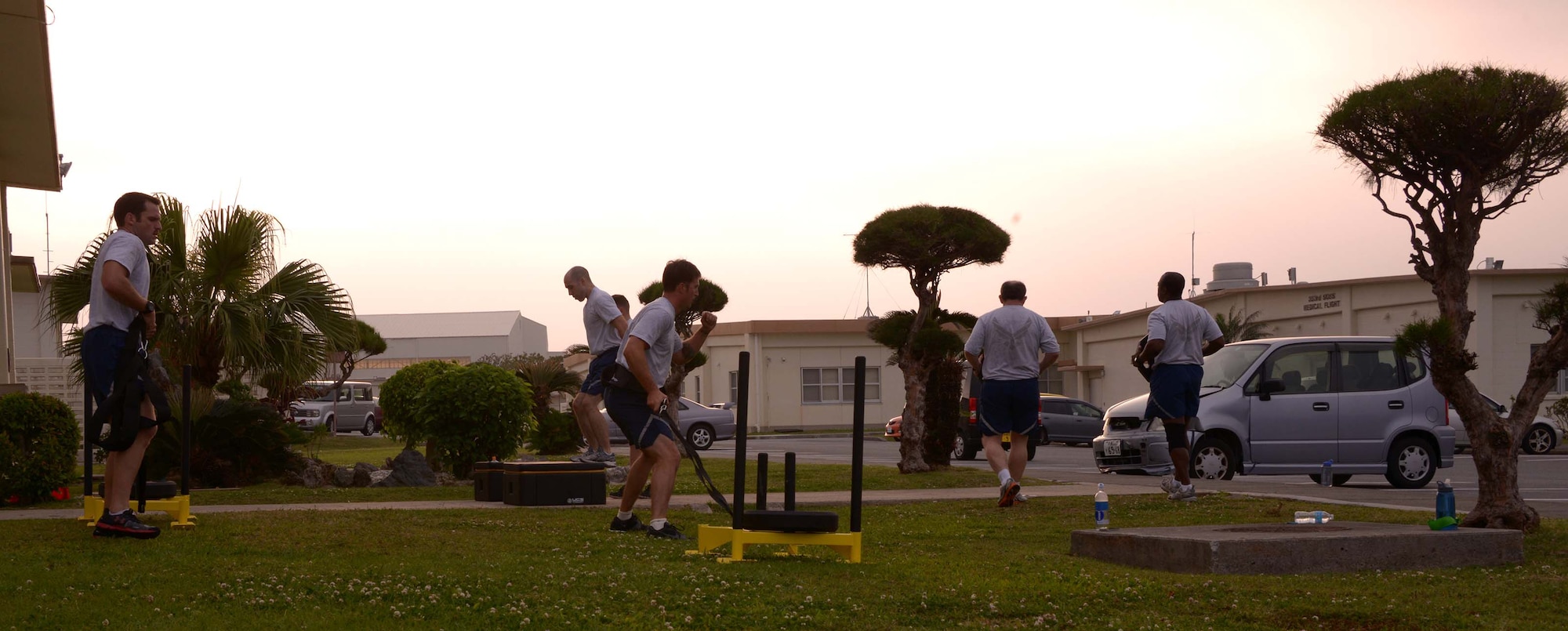 Members of the 320th Special Tactics Squadron, works out in front of the Human Performance Training Center, during squadron physical training March 22 at Kadena Air Base, Japan. The HPTC houses the human performance program, which focuses on not only strengthening the battlefield Airman physically, but also rehabilitating the individual ensuring the Air Force’s human weapons system is performing to its maximum potential for as long as possible.(U.S. Air Force photo by Tech. Sgt. Kristine Dreyer)