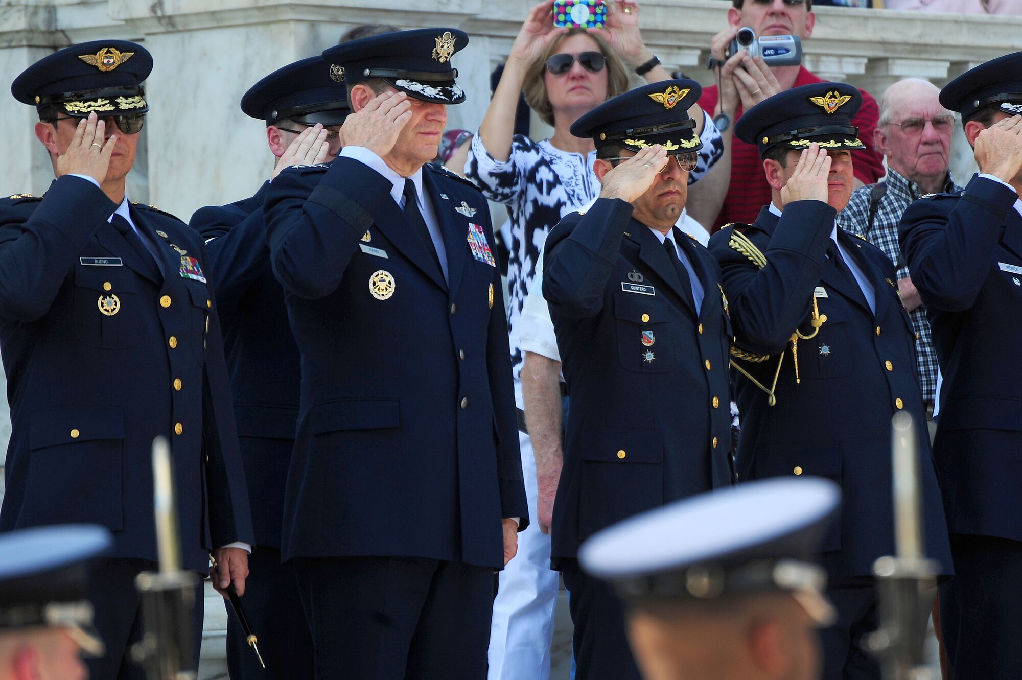 U.S. Air Force and Columbian Air Force Airmen render a salute during the placement of a wreath honoring members of the Columbian Air Force at the Tomb of the Unknown Soldier, April 9, 2013, in Arlington, Va. Air Force District of Washington Commander Maj. Gen. Sharon K. G. Dunbar hosted the ceremony. (U.S. Air Force photo by Senior Airman Steele C. G. Britton)