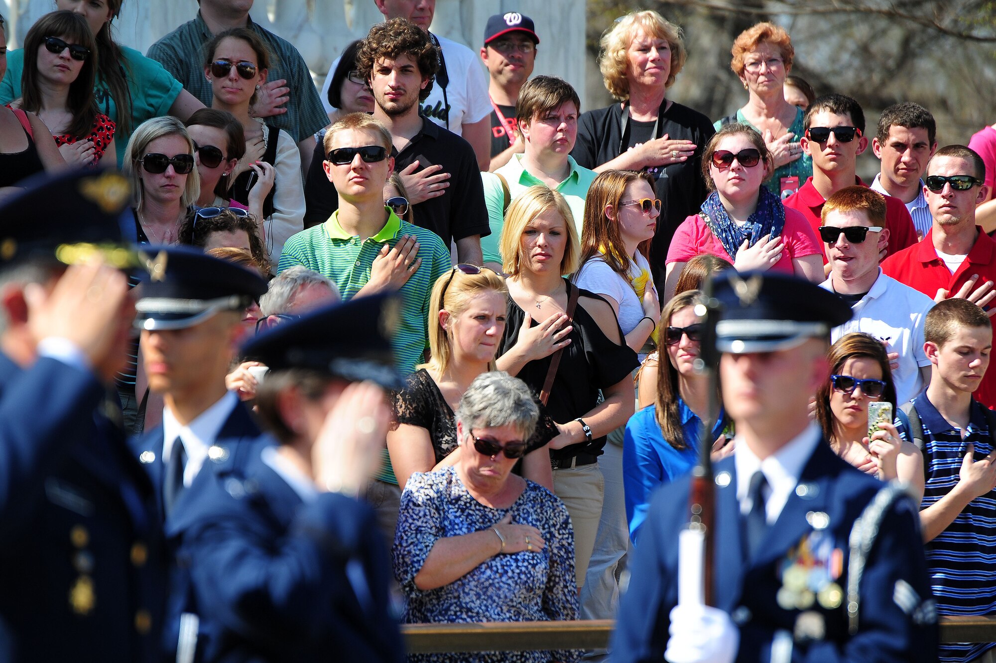 Spectators honor Airmen of the Columbian Air Force during a wreath laying ceremony at the Tomb of the Unknown Soldier, April 9, 2013, in Arlington, Va. Air Force District of Washington Commander Maj. Gen. Sharon K. G. Dunbar hosted the ceremony. (U.S. Air Force photo by Senior Airman Steele C. G. Britton)