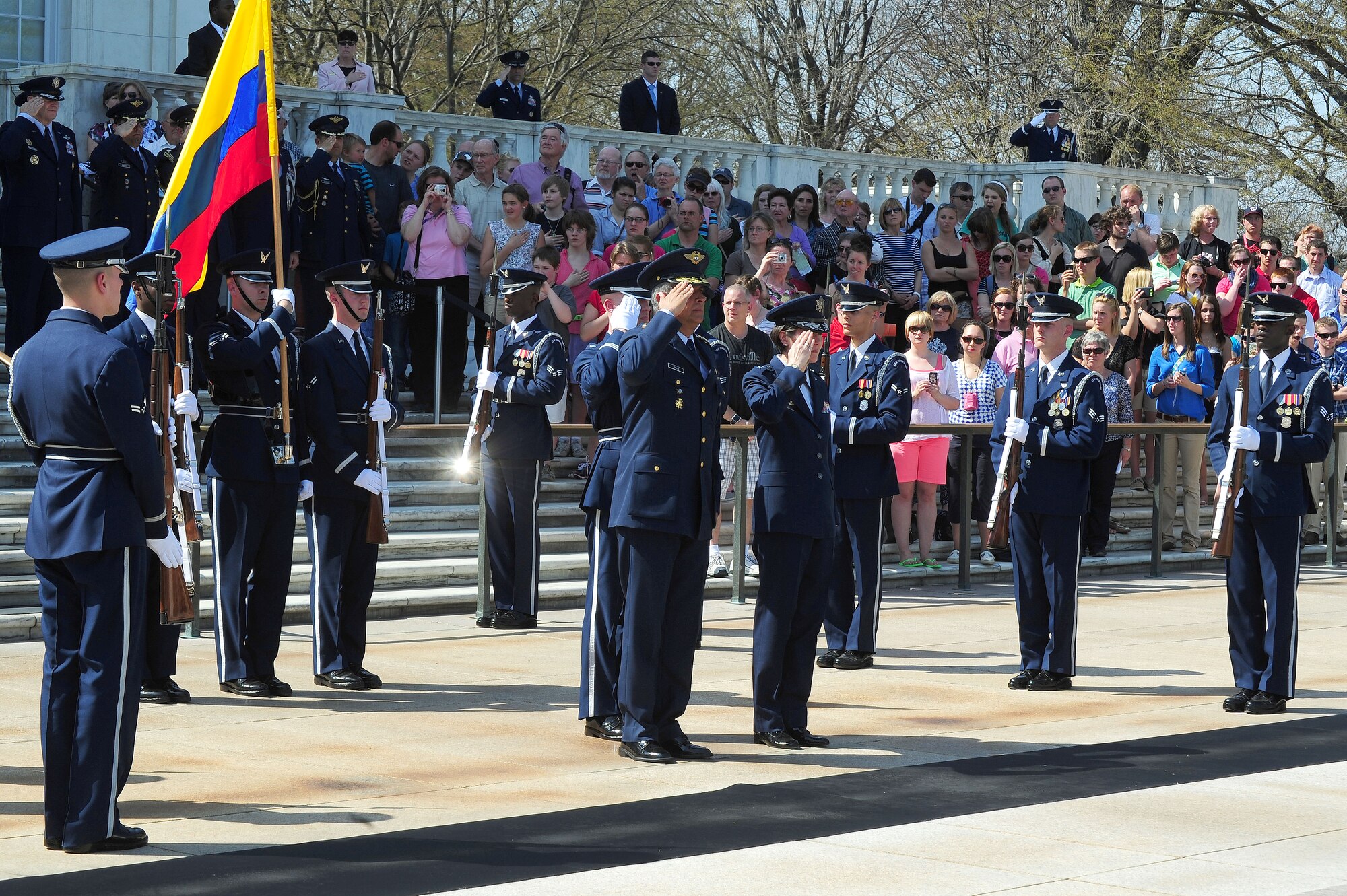 Columbian Air Force Commander Gen. Tito Saul Pinilla Pinilla and Air Force District of Washington Commander Maj. Gen. Sharon K. G. Dunbar render a salute during the playing of The Star-Spangled Banner and Columbian national anthem at a wreath laying ceremony, April 9, 2013, at the Tomb of the Unknown Soldier, in Arlington, Va. The ceremony honored Columbian Air Force Airmen who lost their lives during a time of war. (U.S. Air Force photo by Senior Airman Steele C. G. Britton)