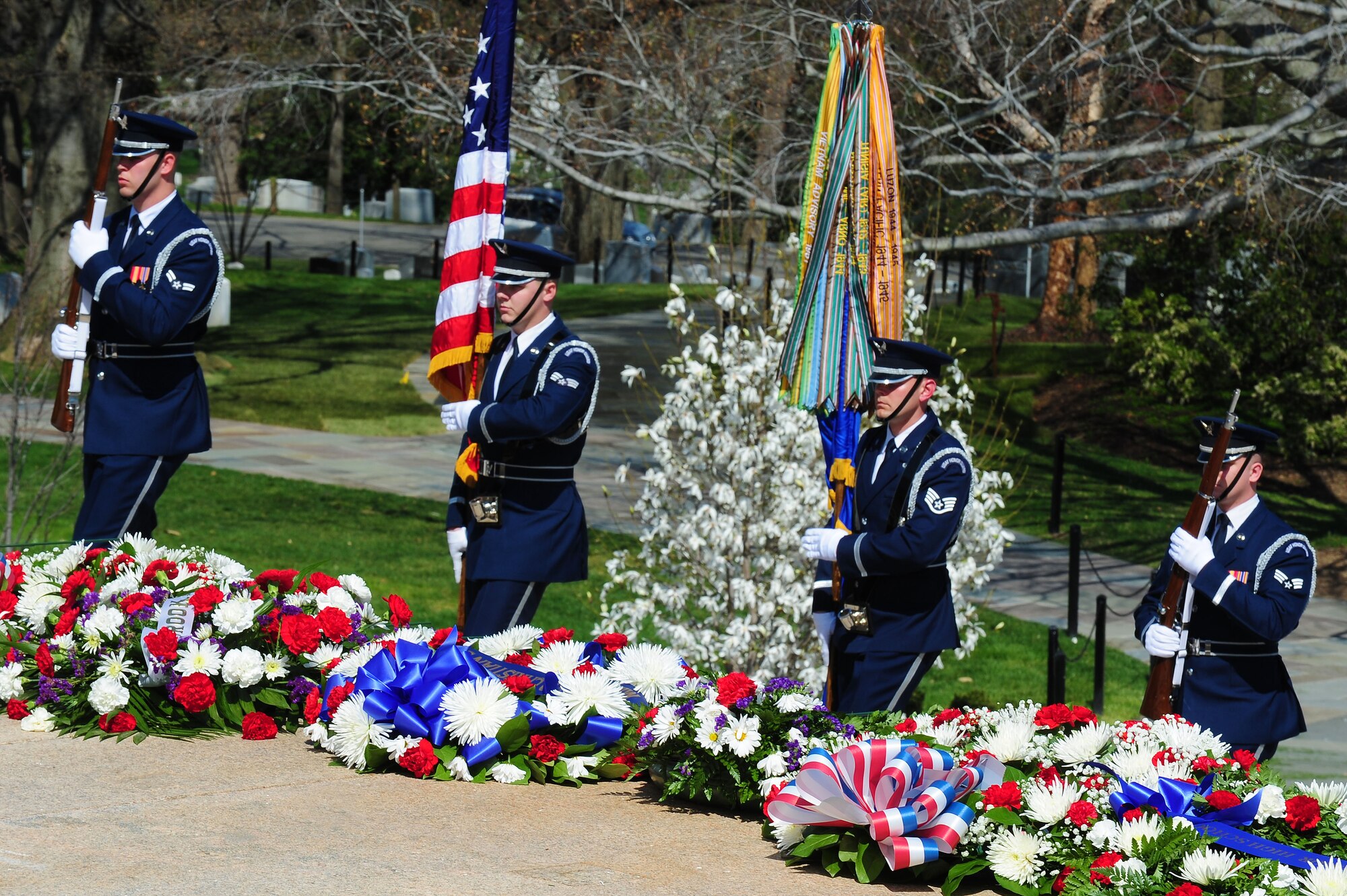 U.S. Air Force Honor Guard colors team members honor Airmen of the Columbian Air Force during a wreath laying ceremony at the Tomb of the Unknown Soldier, April 9, 2013, in Arlington, Va.  Air Force District of Washington leadership and members of the U.S. Air Force Band and Honor Guard rendered honors to members of the Columbian Air Force who lost their lives during a time of war. (U.S. Air Force photo by Senior Airman Steele C. G. Britton)  
