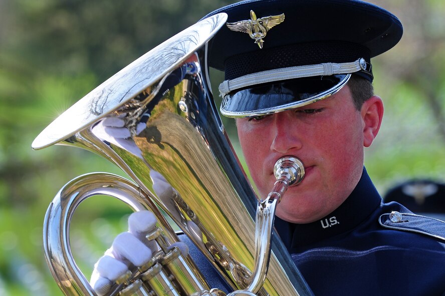Tech. Sgt. Matthew Shipes, U.S. Air Force Band ceremonial brass ensemble euphoniumist, warms up prior to a wreath laying ceremony at Arlington National Cemetery, April 9, 2013, in Arlington, Va. The wreath laying ceremony, held at the Tomb of the Unknown Soldier, honored fallen members of the Colombian Air Force. (U.S. Air Force photo by Senior Airman Steele C. G. Britton)