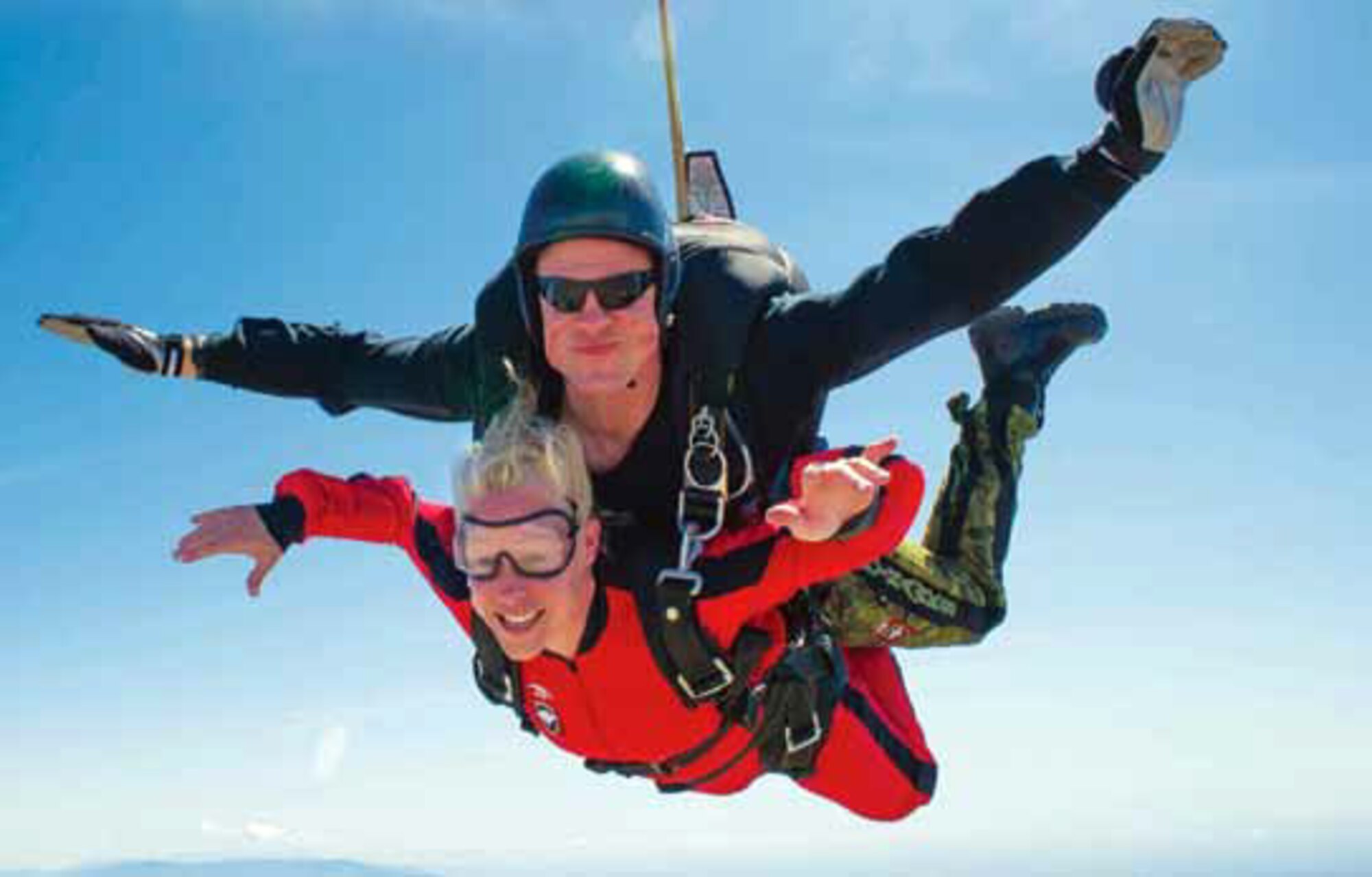 Maj. Amber Marcella, 452d Air Mobility Wing, free falls at 120 miles per hour during
her tandem jump with the Sky Hawks, April 2.The SkyHawks are the Canadian Army’s
premier parachute demonstration team, that travels to Perris, Calif., yearly to practice
skydiving skills and routines. (Photo courtesy of SkyHawks)