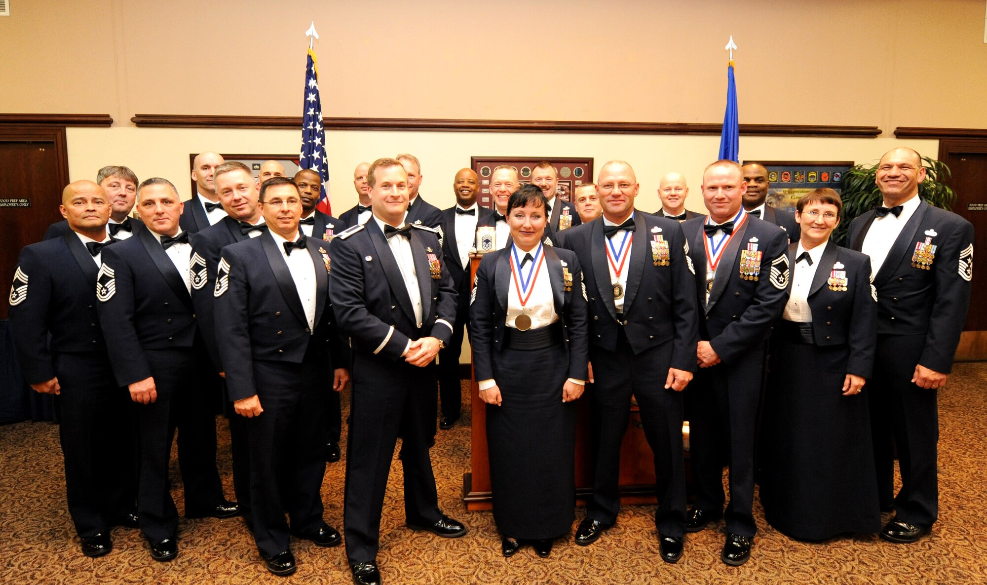Col. Phil Stewart (middle front), 9th Reconnaissance Wing commander, and Chief Master Sgt. Robert White (far right), 9th Reconnaissance Wing command chief, pose with a collection of chief master sergeants near the end of the Chief Recognition Ceremony at the Recce Point Club on Beale Air Force Base, Calif., April 8, 2013. Chief Master Sgt. Geri Dreibelbis, 9th Security Forces Squadron security forces manager, Chief Master Sgt. Thomas Jenkins, 12th Aircraft Maintenance Unit superintendant, and Chief Master Sgt. Aaron Renn, 99th Aircraft Maintenance Unit superintendant, were recognized for achieving the highest enlisted rank. (U.S. Air Force photo by Airman 1st Class Bobby Cummings/Released)