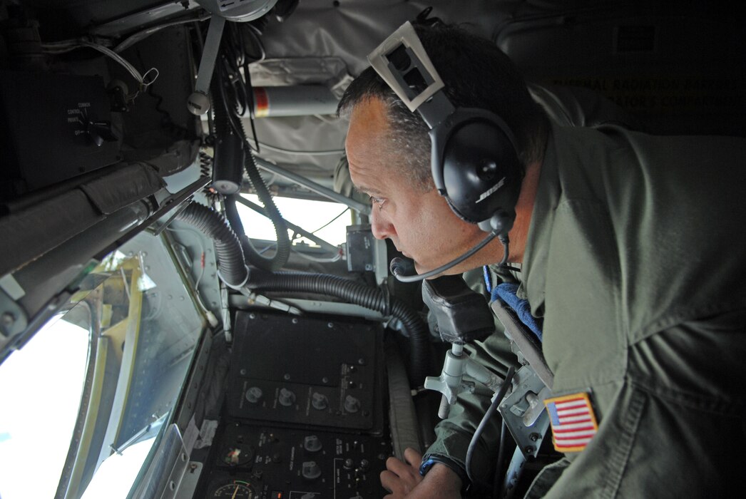Master Sgt. Timothy Molder, boom operator with the 191st Air Refueling Squadron, manages the controls on a KC-135, preparing to refuel a KC-10 from Travis Air Force Base April 9, 2013.  (U.S. Air Force photo by A1C Emily Hulse/Released)