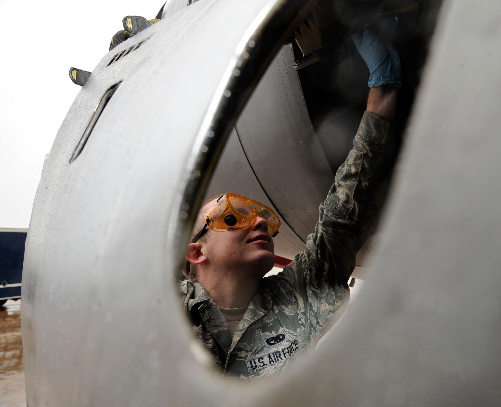 Airman 1st Class Ryan Powers, 2nd Aircraft Maintenance Squadron crew chief, greases latches on a B-52H Stratofortress engine cowling on Barksdale Air Force Base, La., April 11, 2013. Powers is currently enrolled in a field training detachment class. FTD is a six-week course designed to instruct new Airmen from technical school, or Airmen new to the airframe, more detailed aspects of their job, whether they are hydraulics, crew chiefs, or aerospace ground equipment. (U.S. Air Force photo/Airman 1st Class Andrew Moua)