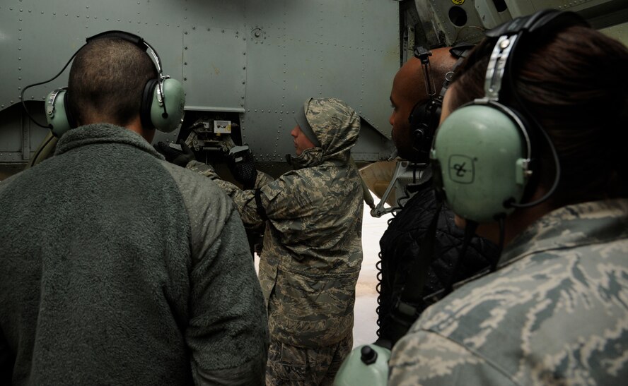 Tech. Sgt. Mark Hughes, 372nd Training Squadron Detachment 5 B-52H Stratofortress Hydraulics instructor, teaches his field training detachment class about the aft bomb door latch assembly on a B-52 on Barksdale Air Force Base, La., April 11, 2013. Hughes manually operated the latch to show his students how the latches operate when the bomb doors close. (U.S. Air Force photo/Airman 1st Class Andrew Moua)