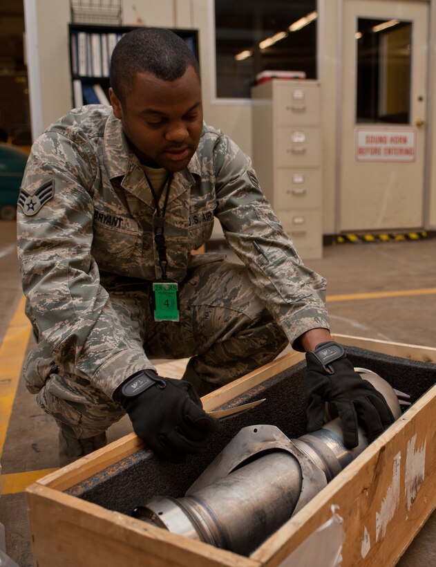 Senior Airman Horace Bryant, 28th Logistics Readiness Squadron flight service center technician, verifies that a part and its tag numbers match while processing parts at Ellsworth Air Force Base, S.D., March 28, 2013. The flight service Airmen are responsible for the tracking, inspecting, verifying, delivering and picking up all parts on Ellsworth. (U.S. Air Force photo by Airman 1st Class Alystria Maurer/Released)