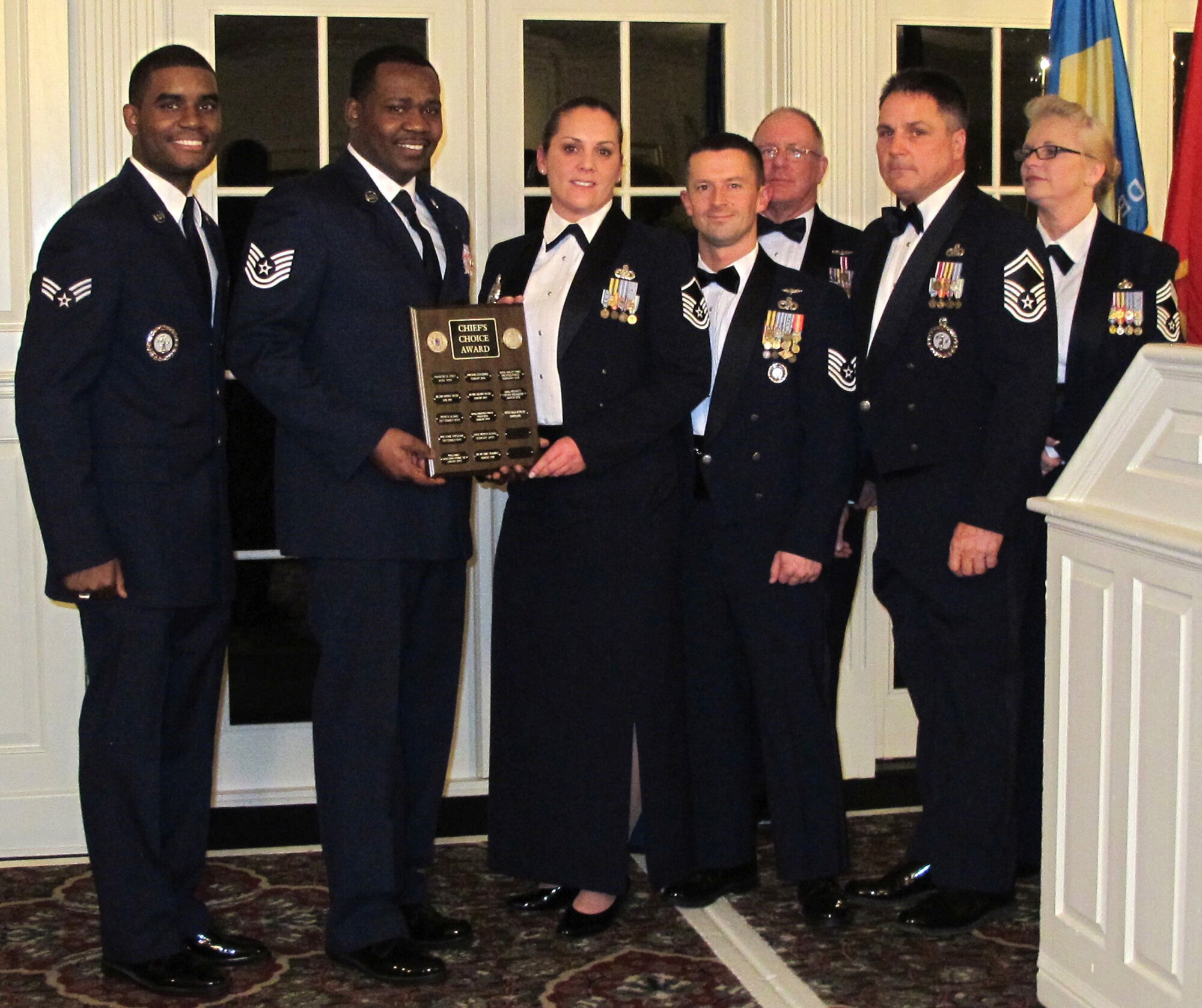 The Delaware Air National Guard recruiting team receives the Chief’s Choice award from the Chief Master Sergeant’s Council during the Delaware ANG Annual Enlisted Recognition Banquet held March 2, 2013 at the Deerfield Golf and Tennis Club in Newark, Del. For FY2012 the Delaware ANG gained 168 people, and finished the year with a retention rate of 91 percent and a re-enlistment rate of 94 percent. Overall end strength rose from 89.5 to 96.4 percent in the fiscal year. Left to right, front: Recruiting team members Senior Airman Desmond Overton, Tech. Sgt. Terrence Parker, Master Sgt. Tanya Harris, Tech. Sgt. Sam Lewis and Senior Master Sgt. Mike Davis. Standing at rear are Chief Master Sergeants Mike Forsyth and Patricia Ottinger. Not present: recruiter Tech. Sgt. Kristin Favors. (Air National Guard photo/Tech. Sgt. Benjamin Matwey)