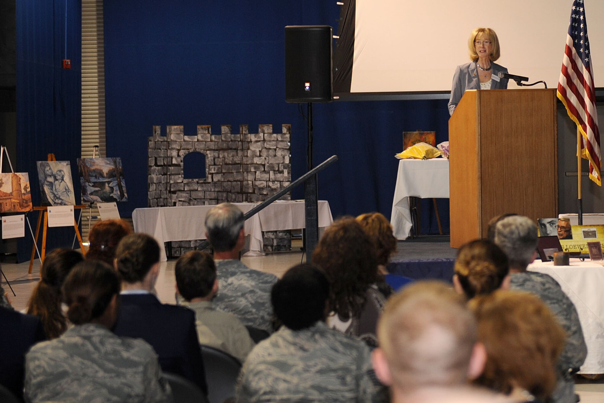 Betsy Karotkin reads the story of the late Hanns Loewenbach during the Holocaust Days of Remembrance Commemoration at Langley Air Force Base, Va., April 8, 2013. Loewenach, a victim of the Holocaust, was a personal friend of Karotkin, who was the guest speaker during the commemoration.  (U.S. Air Force photo by Senior Airman Brittany Paerschke-O’Brien/Released)