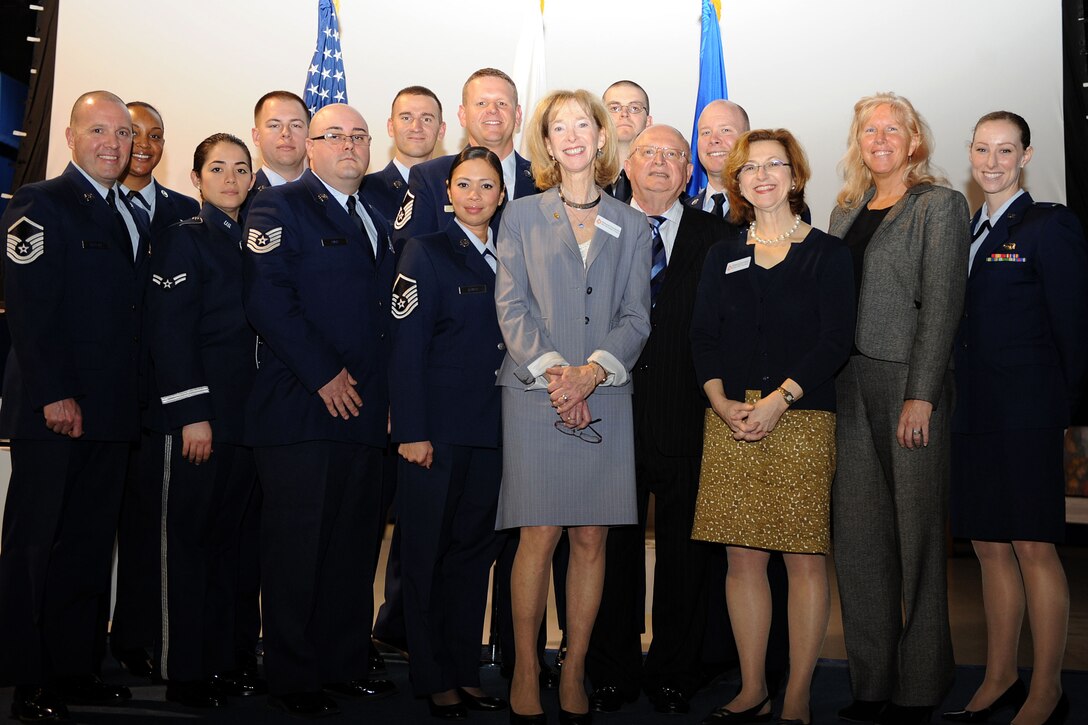 Members of the Holocaust Remembrance Day committee and other program participants stand for a group photo with guest speaker, Betsy Karotkin, during the Holocaust Remembrance Day Commemoration at Langley Air Force Base, Va., April 8, 2013. Karotkin read the story of the late Hanns Loewenbach, a personal friend and victim of the Holocaust, during the event. (U.S. Air Force photo by Senior Airman Brittany Paerschke-O’Brien/Released)