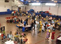 Visitors crowd the floor of the Beautiful Child Photo Shoot and Activity Fair held April 9, 2013, at Liberty Square on Grand Forks Air Force Base, N.D. About 225 people attended the fair this year in observance of “Month of the Military Child.” (U.S. Air Force photo/ Airman 1st Class Zachiah Roberson)