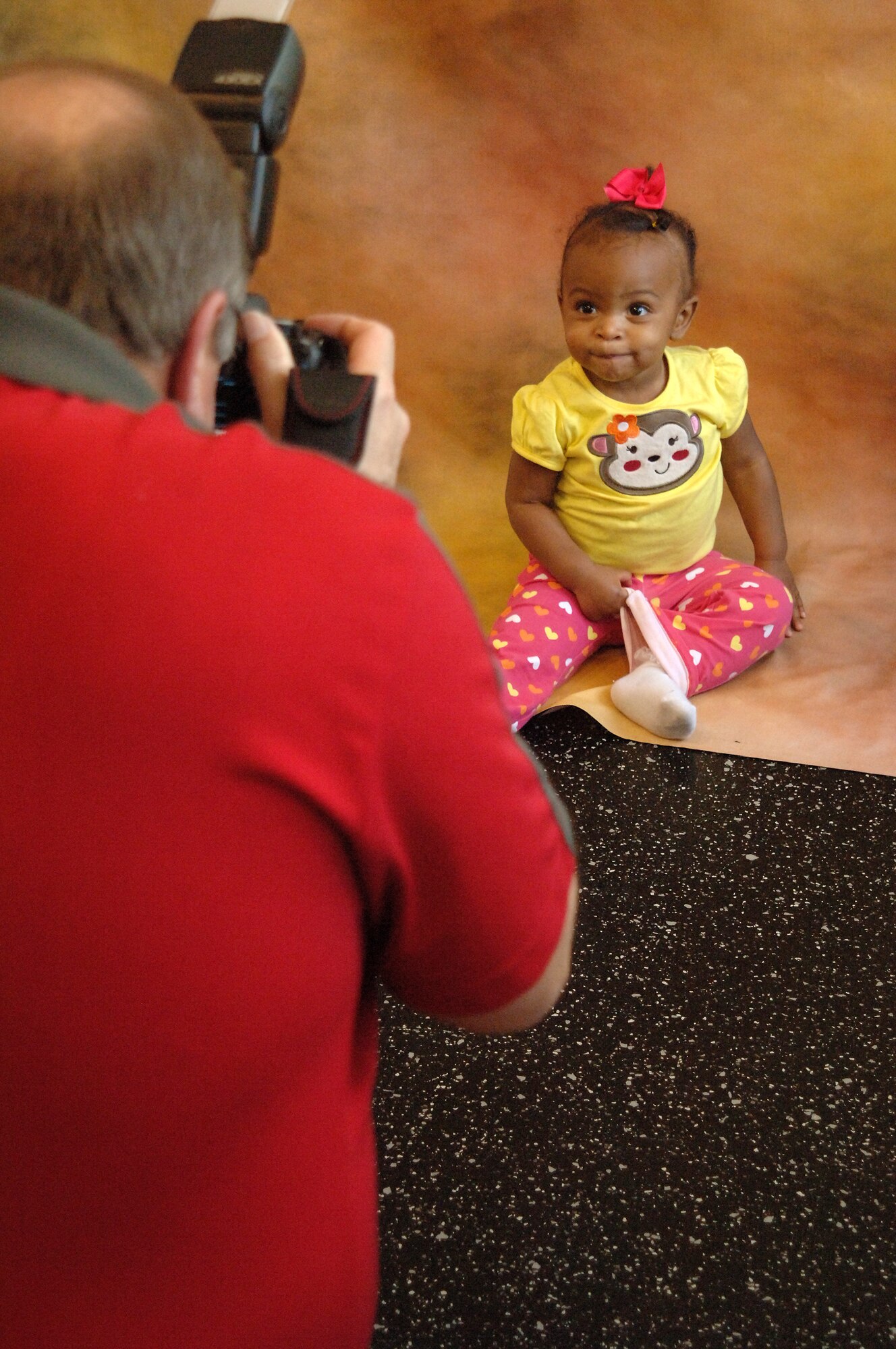 Karis Roberts, daughter of Airman 1st Class Reginald Roberts, poses for a photo during the Beautiful Child Photo Shoot and Activity Fair held April 9, 2013, at Liberty Square on Grand Forks Air Force Base, N.D. The fair’s goal was to give families a chance to get together in a child-friendly environment to learn about healthy living. (U.S. Air Force photo/ Airman 1st Class Zachiah Roberson)
