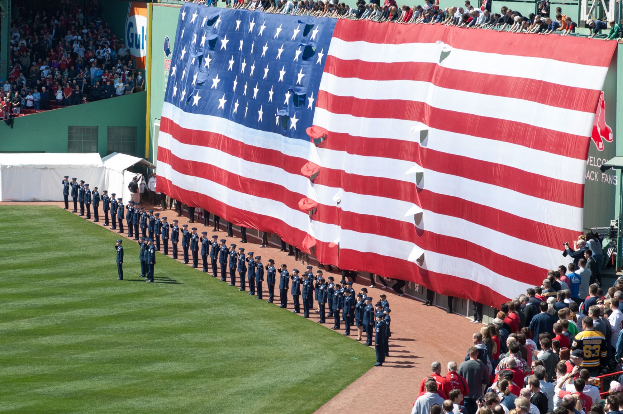 BOSTON – Airmen salute during the playing of the national anthem during a Boston Red Sox vs. Baltimore Orioles game at Fenway Park April 8. Hanscom personnel were invited on field as part of opening day festivities. (U.S. Air Force photo by Rick Berry)